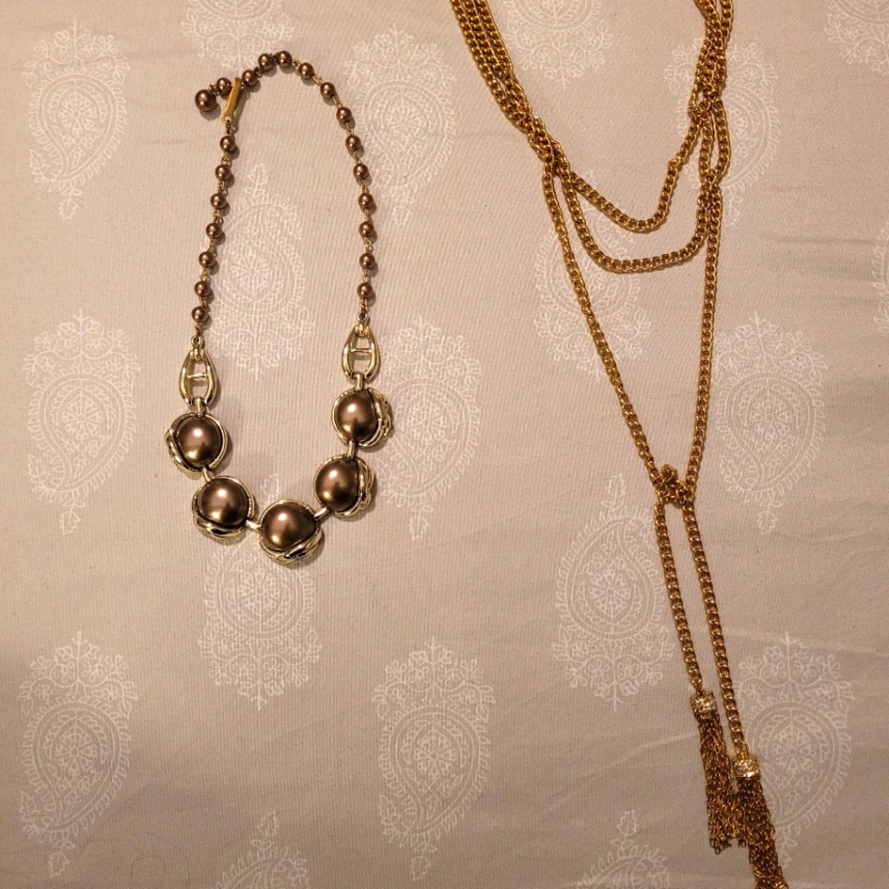 Three layered gold chain with tassels.